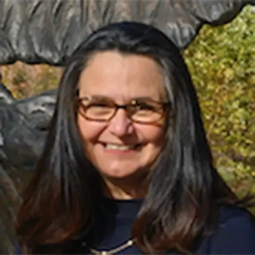 Headshot image of Dr. Andrea Lobo smiling.